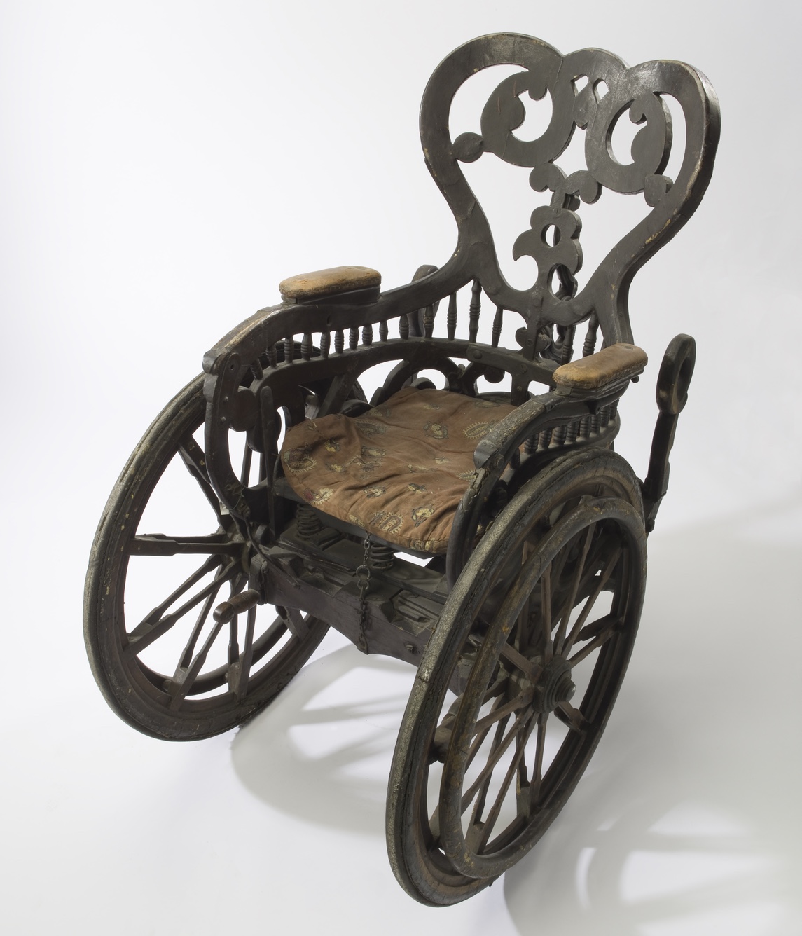 A heavy metal wheelchair design for King Philip of Spain, early depictions came from ancient China and Greece.